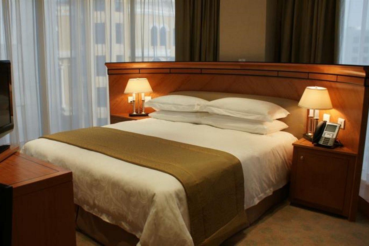 Wiseman Grand Hotel Doha Exterior foto A bed